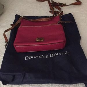 Fuschia Dooney and Bourke cross shoulder bag.